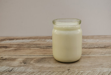 milk in a jar on a wooden table