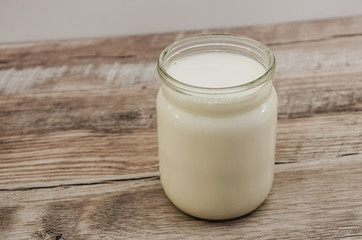 milk in a jar on a wooden table