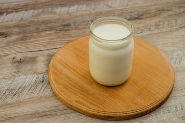milk in a jar on a wooden table