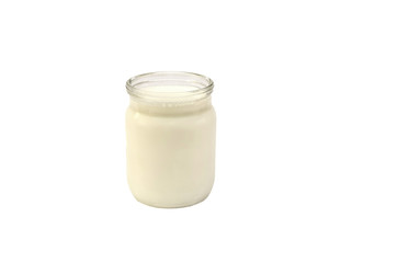 milk in a jar on a white background