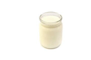 milk in a jar on a white background