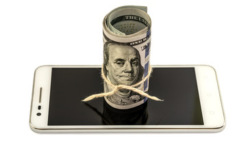twisted dollars on smartphone on white background