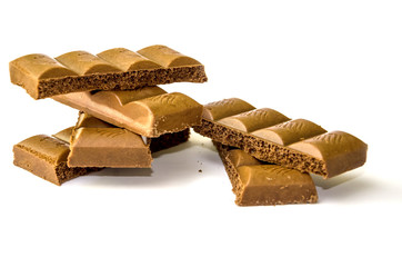 milky, porous chocolate on a white background