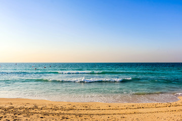 Fototapeta na wymiar Horizon of Seascape, water waves at Jumeirah Beach in Dubai, United Arab Emirates