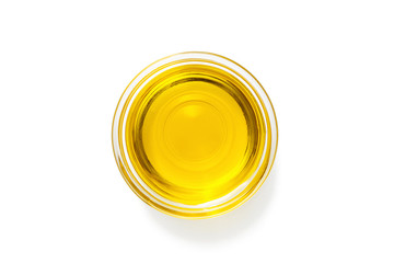 Bowl with olive oil isolated on white.