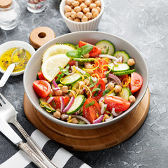 Salad of chickpeas, tomatoes, cucumbers and greens. Dietary food. Vegan salad.