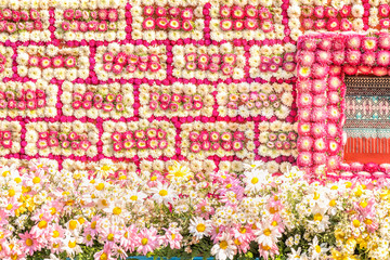details of intricate patterns of flower art on a floral float