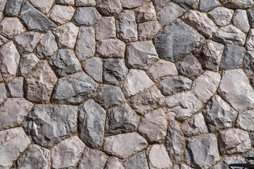 Close up varies size fragment of rock stone wall texture in gray color for wallpaper, background or decoration printables.