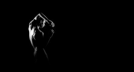 Black and white silhouette of male ballet dancer. Long monochrom horizontal image.