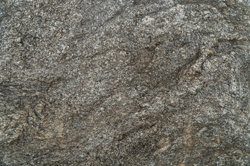 Dark grey, white and brown color natural stone texture background.