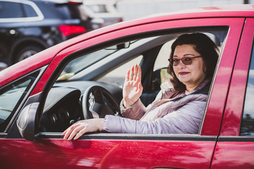 Mature woman car driver, outdoor portrait, automobile and lady 