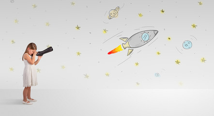 Little girl looking through spyglass to imaginary rockets and doodled space
