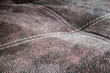 contrast stitching on the upholstery of the sofa. background