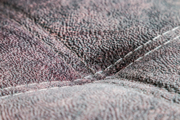 contrast stitching on the upholstery of the sofa. background