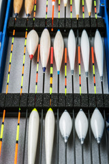many different fishing floats in the box. fishing tackle and accessories for catching Herabuna