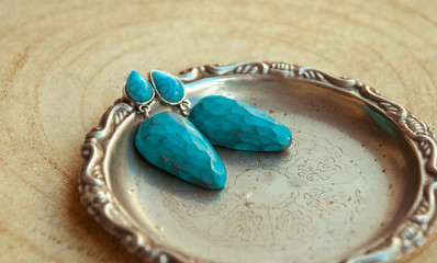 Handmade silver turquoise  boho earrings. Trend luxury jewelry.Fashion background.