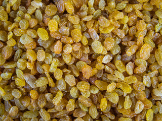 Set of white raisin on a counter of shop. Golden grapes