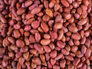 Set of crude peanut on a show-window of shop. Sale of nuts in the market