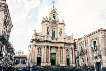 Fototapeta na wymiar Beautiful cityscape of Italy, facade of old cathedral Catania, Sicily, Italy, Basilica della Collegiata, famouse baroque church.