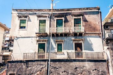 beautiful cityscape of Italy, historical street of Catania, Sicily, facade of old buildings.