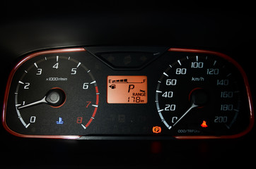 Detail with the gauges on the dashboard of a modern car.