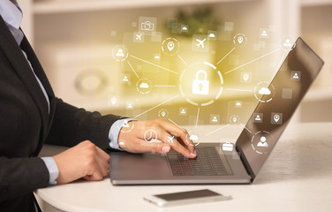 Business woman below chest working on laptop in a cozy homey environment with secured connection concept
