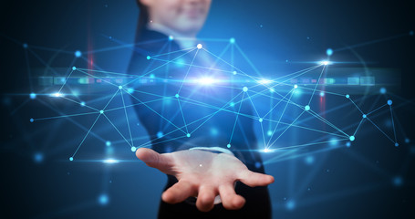 Handsome person holding hologram screen displaying modern cloud based web system technology
