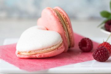 A beautiful heart made of macaroons and raspberry. Valentines day consept. flat lay, top view. 