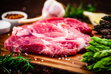Fresh raw beef steaks on cutting board
