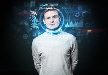 Facial recognition system. Young man on dark background, face recognition concept