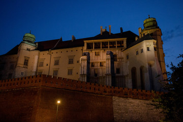 Fototapeta na wymiar buildings in Krakow at night by the light of lanterns