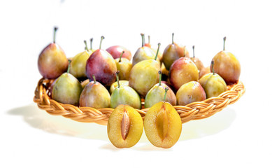 isolated fresh prunes on white background