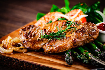 Grilled steak with french fries and vegetables