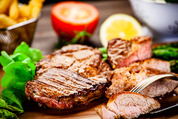 Grilled steak with french fries and vegetables