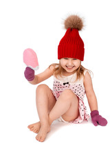 baby in hat and mittens holding ice cream on white background