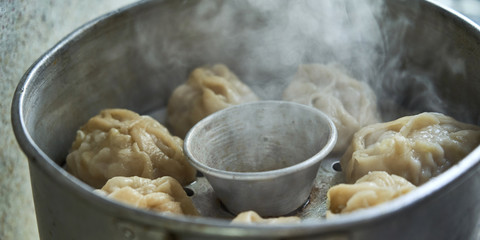 Uzbek national food manta, like dumplings, in a steamer, steamed food.