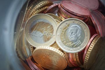 Closeup of Euro coins in bottle and shadow as business, money, banking, currency and exchange rate...