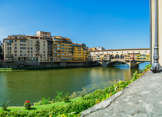Panoramic view on Ponte Vecchio over Arno river in Florence, Italy
