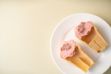 a glass of ice cream half empty is cut into two parts . with free text, copy space,