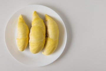 Top view of fresh pulp of Durian yellow color on dish isolated on white background