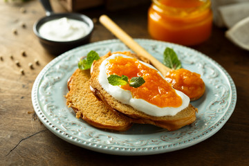 Toasts with cream cheese and citrus jam