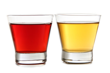 Glass jars with colorful cocktails on a white background