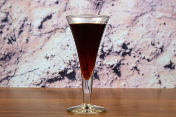 Black currant liqueur in a glass