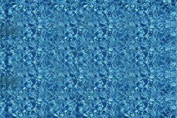 Fototapeta na wymiar Blue ripped water with sunny reflections. Water in rippled water detail background.