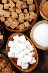 Fototapeta premium Various types of sugar, brown sugar and white on rustic wooden table