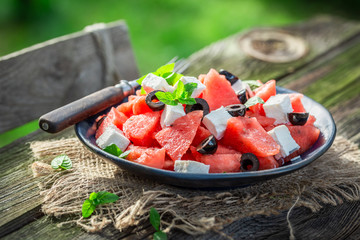 Delicious watermelon salad with feta cheese and black olives - obrazy, fototapety, plakaty