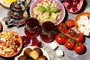 Middle eastern or arabic dishes and assorted meze, concrete rustic background. Falafel. Turkish...