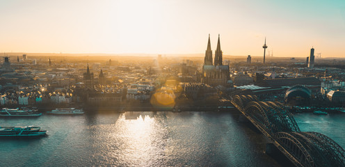 Panoramic view of Cologne, Germany at sunset - obrazy, fototapety, plakaty