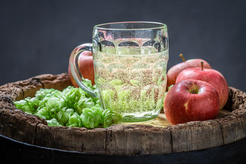 Cold and sweet cider beer on old wooden barrel