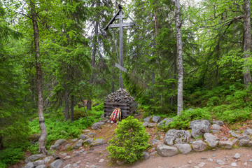 SOLOVKI, REPUBLIC OF KARELIA, RUSSIA - JUNE 27, 2018: Memorial cross in the Holy Ascension skete under the Sekirnaya mountain. The Solovetsky Monastery. Solovki Islands, Arkhangelsk region, White Sea © Konstantin